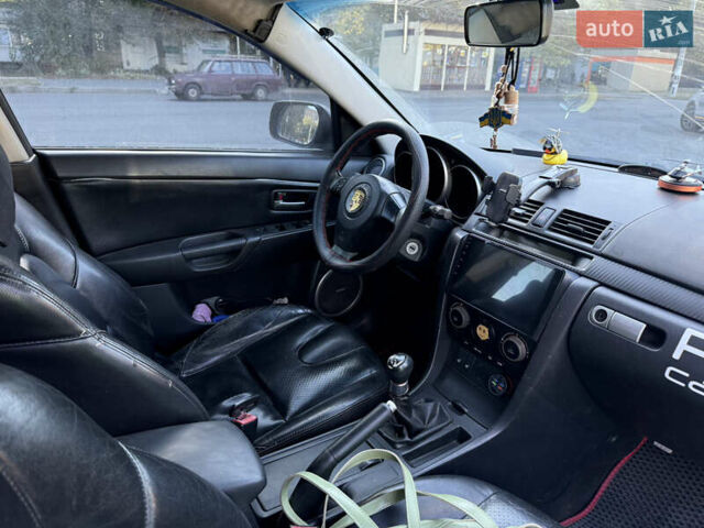 Чорний Мазда 3, об'ємом двигуна 2 л та пробігом 173 тис. км за 2999 $, фото 2 на Automoto.ua