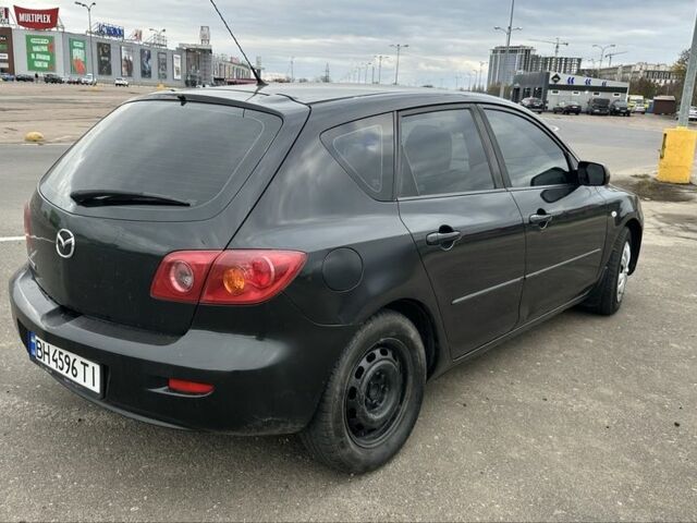 Черный Мазда 3, объемом двигателя 1.3 л и пробегом 190 тыс. км за 3200 $, фото 3 на Automoto.ua