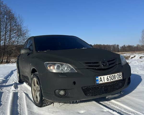 Чорний Мазда 3, об'ємом двигуна 2 л та пробігом 372 тис. км за 3900 $, фото 4 на Automoto.ua