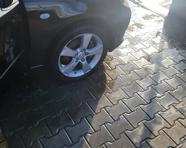 Черный Мазда 3, объемом двигателя 2 л и пробегом 193 тыс. км за 6000 $, фото 1 на Automoto.ua