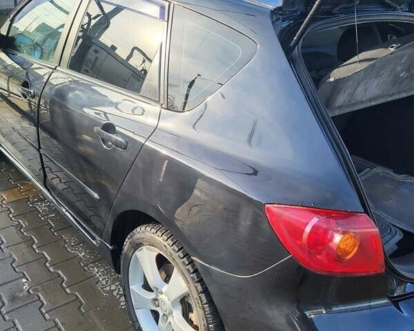Черный Мазда 3, объемом двигателя 2 л и пробегом 193 тыс. км за 6000 $, фото 9 на Automoto.ua