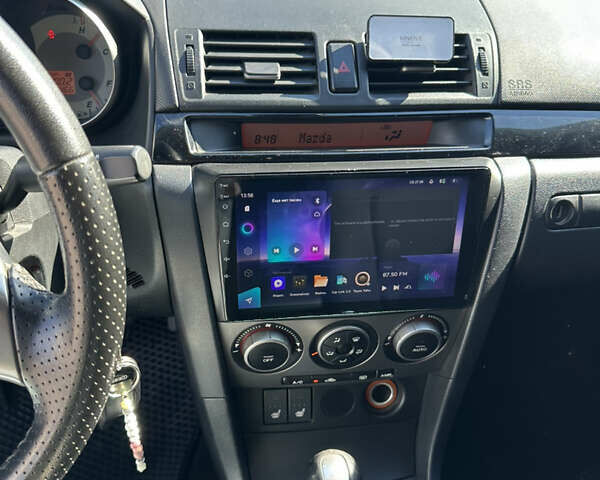 Чорний Мазда 3, об'ємом двигуна 1.6 л та пробігом 236 тис. км за 4555 $, фото 9 на Automoto.ua