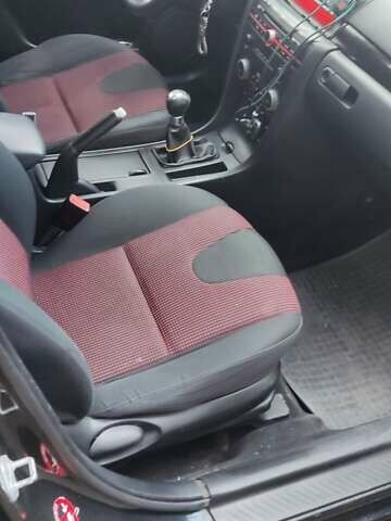 Черный Мазда 3, объемом двигателя 1.6 л и пробегом 260 тыс. км за 2800 $, фото 2 на Automoto.ua