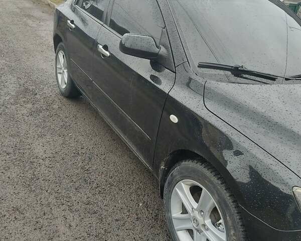 Черный Мазда 3, объемом двигателя 1.6 л и пробегом 285 тыс. км за 4000 $, фото 2 на Automoto.ua
