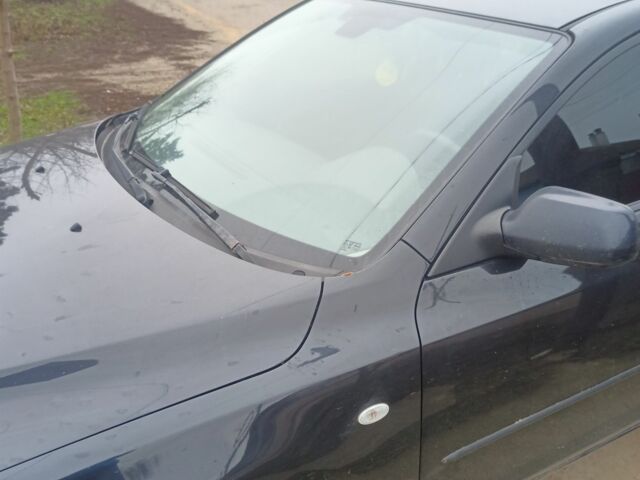 Черный Мазда 3, объемом двигателя 2 л и пробегом 175 тыс. км за 5500 $, фото 1 на Automoto.ua