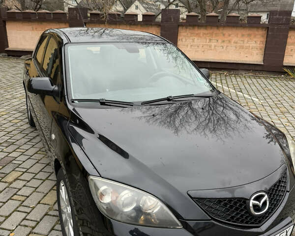 Черный Мазда 3, объемом двигателя 1.6 л и пробегом 217 тыс. км за 5800 $, фото 1 на Automoto.ua