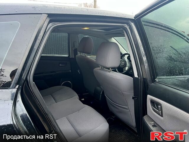 Черный Мазда 3, объемом двигателя 1.6 л и пробегом 212 тыс. км за 5500 $, фото 6 на Automoto.ua