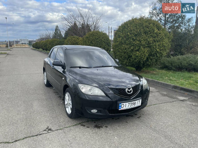 Черный Мазда 3, объемом двигателя 2 л и пробегом 252 тыс. км за 4000 $, фото 1 на Automoto.ua