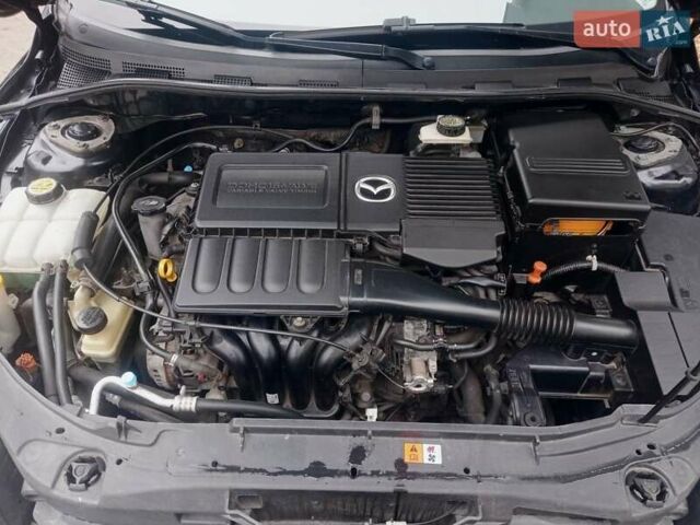 Черный Мазда 3, объемом двигателя 1.6 л и пробегом 165 тыс. км за 6100 $, фото 30 на Automoto.ua