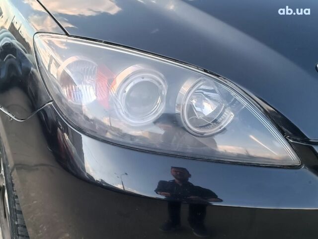 Чорний Мазда 3, об'ємом двигуна 1.6 л та пробігом 187 тис. км за 4990 $, фото 3 на Automoto.ua