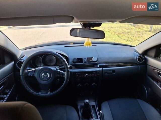 Черный Мазда 3, объемом двигателя 2 л и пробегом 198 тыс. км за 6200 $, фото 4 на Automoto.ua