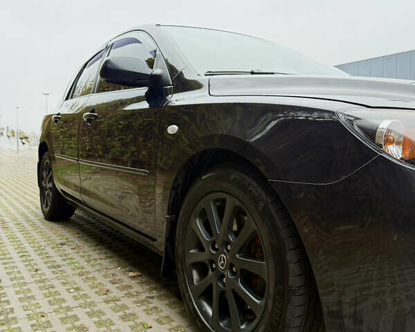 Черный Мазда 3, объемом двигателя 2 л и пробегом 274 тыс. км за 6800 $, фото 6 на Automoto.ua