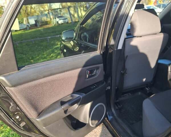 Черный Мазда 3, объемом двигателя 2 л и пробегом 198 тыс. км за 6200 $, фото 5 на Automoto.ua