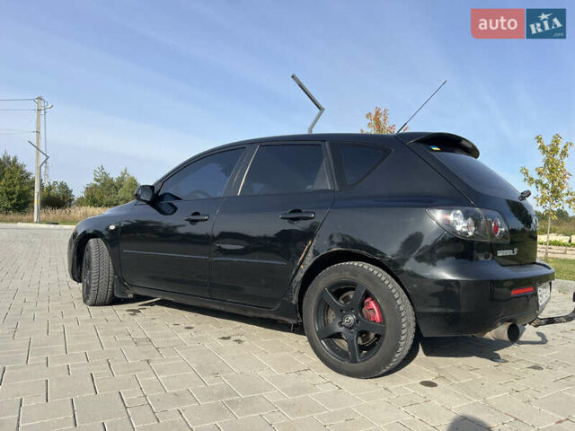 Чорний Мазда 3, об'ємом двигуна 2 л та пробігом 288 тис. км за 5500 $, фото 4 на Automoto.ua