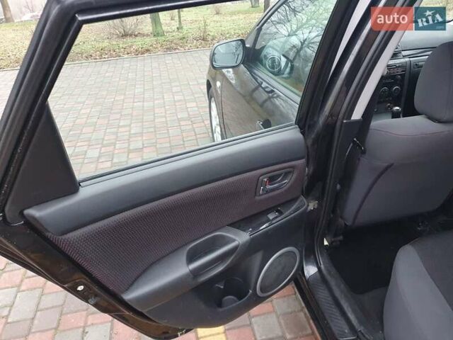 Черный Мазда 3, объемом двигателя 1.6 л и пробегом 264 тыс. км за 5700 $, фото 15 на Automoto.ua
