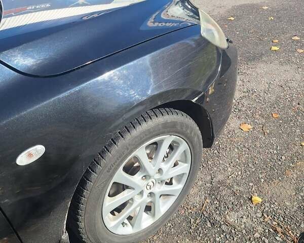 Черный Мазда 3, объемом двигателя 2 л и пробегом 198 тыс. км за 6200 $, фото 18 на Automoto.ua