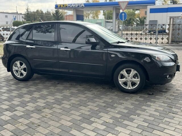 Черный Мазда 3, объемом двигателя 1.6 л и пробегом 215 тыс. км за 5850 $, фото 1 на Automoto.ua