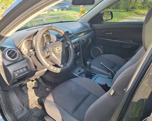 Черный Мазда 3, объемом двигателя 2 л и пробегом 198 тыс. км за 6200 $, фото 7 на Automoto.ua