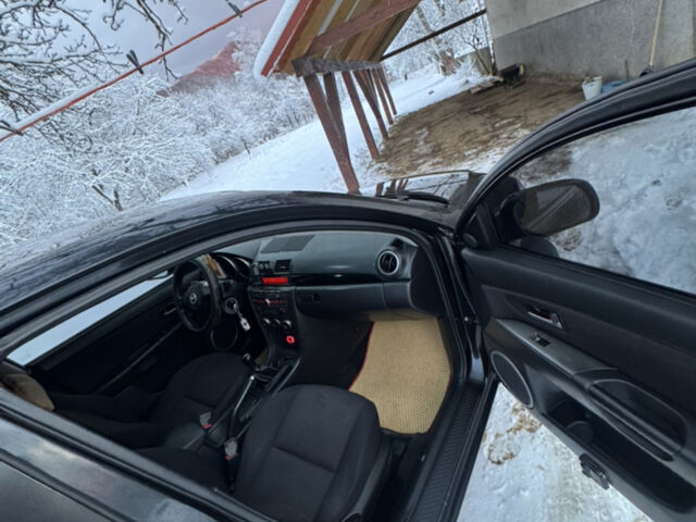 Черный Мазда 3, объемом двигателя 1.6 л и пробегом 290 тыс. км за 5000 $, фото 7 на Automoto.ua