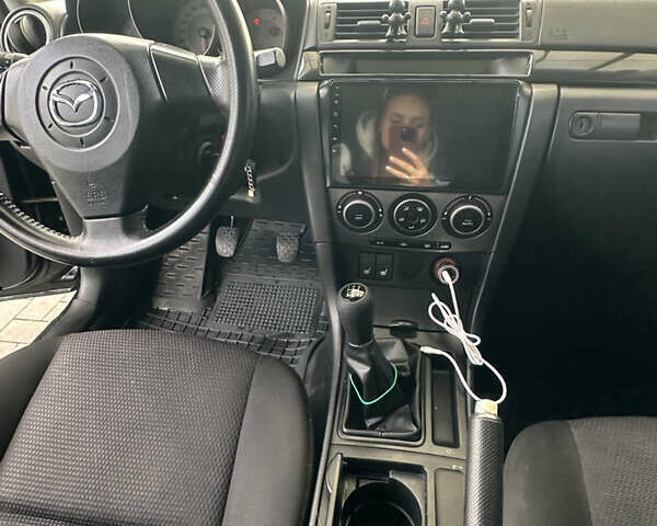Чорний Мазда 3, об'ємом двигуна 1.6 л та пробігом 215 тис. км за 5500 $, фото 14 на Automoto.ua