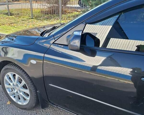 Черный Мазда 3, объемом двигателя 2 л и пробегом 198 тыс. км за 6200 $, фото 17 на Automoto.ua