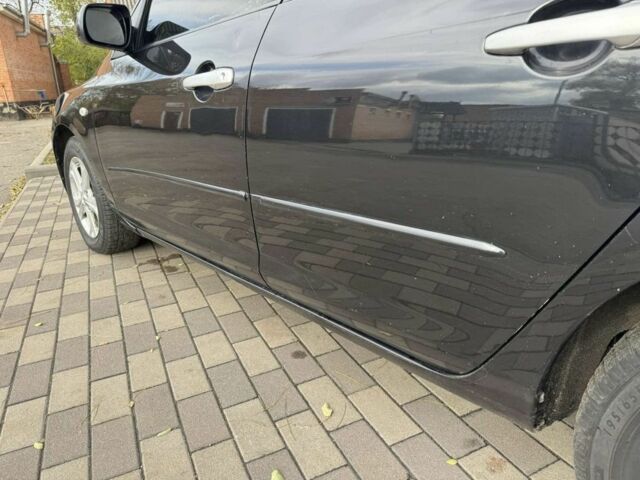 Черный Мазда 3, объемом двигателя 1.6 л и пробегом 215 тыс. км за 5850 $, фото 2 на Automoto.ua