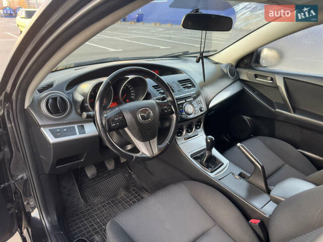 Черный Мазда 3, объемом двигателя 1.6 л и пробегом 127 тыс. км за 7500 $, фото 44 на Automoto.ua