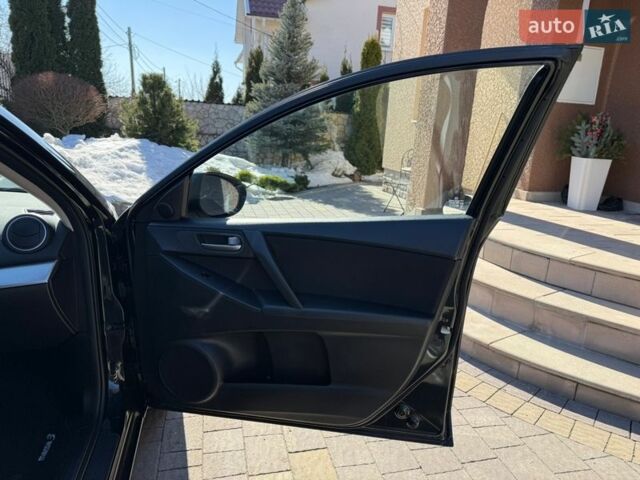 Чорний Мазда 3, об'ємом двигуна 2 л та пробігом 193 тис. км за 8762 $, фото 56 на Automoto.ua