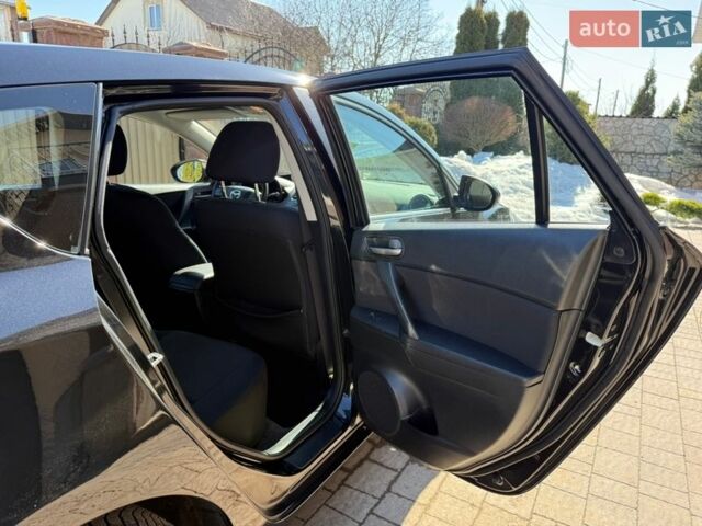 Чорний Мазда 3, об'ємом двигуна 2 л та пробігом 193 тис. км за 8762 $, фото 48 на Automoto.ua