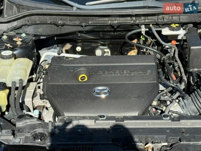 Чорний Мазда 3, об'ємом двигуна 2 л та пробігом 193 тис. км за 8762 $, фото 67 на Automoto.ua