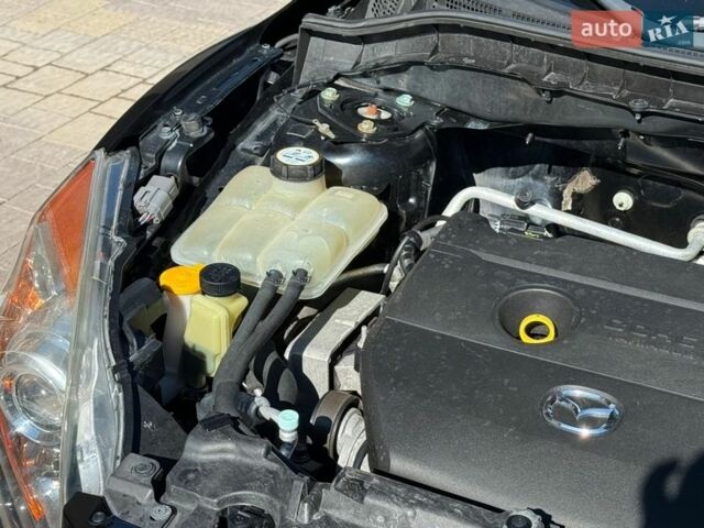 Чорний Мазда 3, об'ємом двигуна 2 л та пробігом 193 тис. км за 8762 $, фото 68 на Automoto.ua