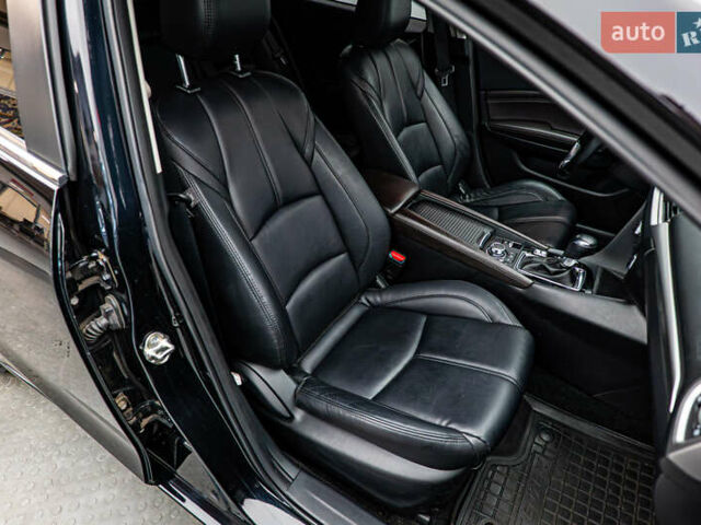 Черный Мазда 3, объемом двигателя 2 л и пробегом 104 тыс. км за 12390 $, фото 17 на Automoto.ua