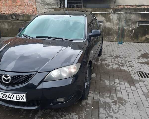 Чорний Мазда 3, об'ємом двигуна 2 л та пробігом 240 тис. км за 5999 $, фото 1 на Automoto.ua