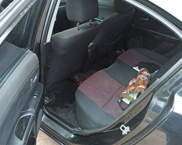 Чорний Мазда 3, об'ємом двигуна 2 л та пробігом 319 тис. км за 4000 $, фото 3 на Automoto.ua