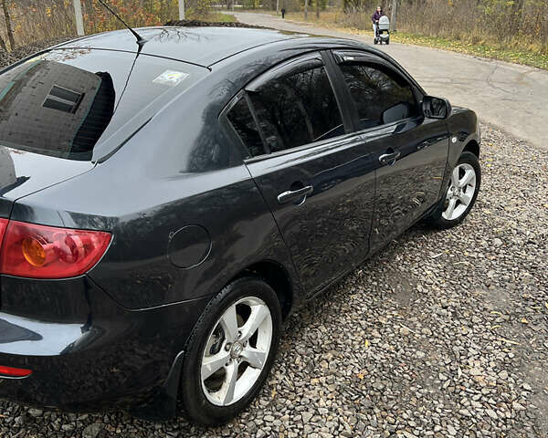 Чорний Мазда 3, об'ємом двигуна 1.6 л та пробігом 346 тис. км за 4600 $, фото 3 на Automoto.ua