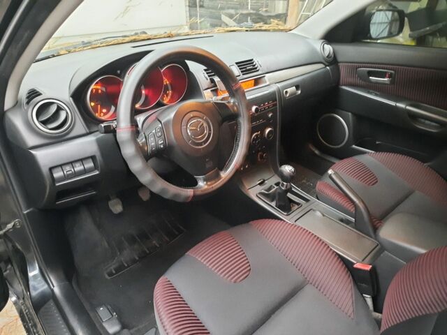 Чорний Мазда 3, об'ємом двигуна 2 л та пробігом 153 тис. км за 5500 $, фото 6 на Automoto.ua