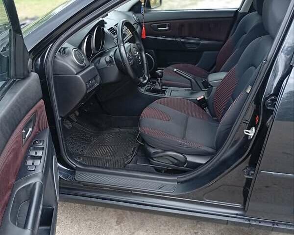Черный Мазда 3, объемом двигателя 2 л и пробегом 242 тыс. км за 5000 $, фото 6 на Automoto.ua