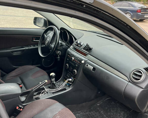 Черный Мазда 3, объемом двигателя 2 л и пробегом 232 тыс. км за 4700 $, фото 6 на Automoto.ua