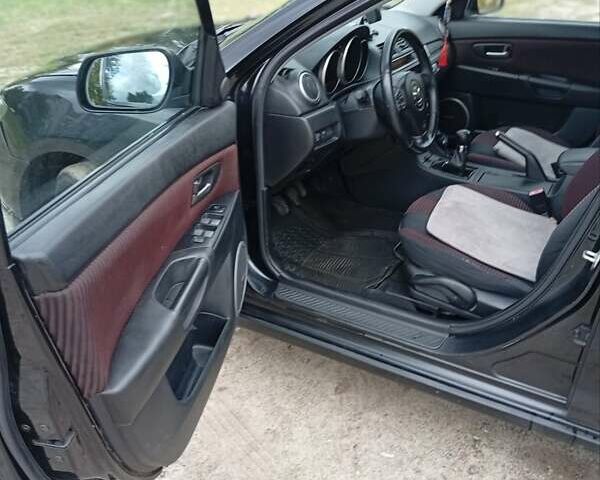 Черный Мазда 3, объемом двигателя 2 л и пробегом 242 тыс. км за 5000 $, фото 4 на Automoto.ua