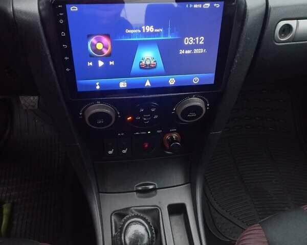 Чорний Мазда 3, об'ємом двигуна 2 л та пробігом 245 тис. км за 5200 $, фото 11 на Automoto.ua