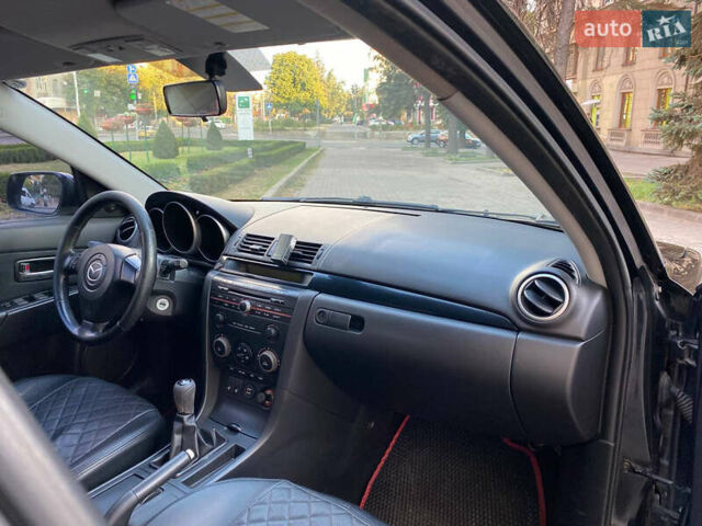 Черный Мазда 3, объемом двигателя 2 л и пробегом 300 тыс. км за 5200 $, фото 5 на Automoto.ua