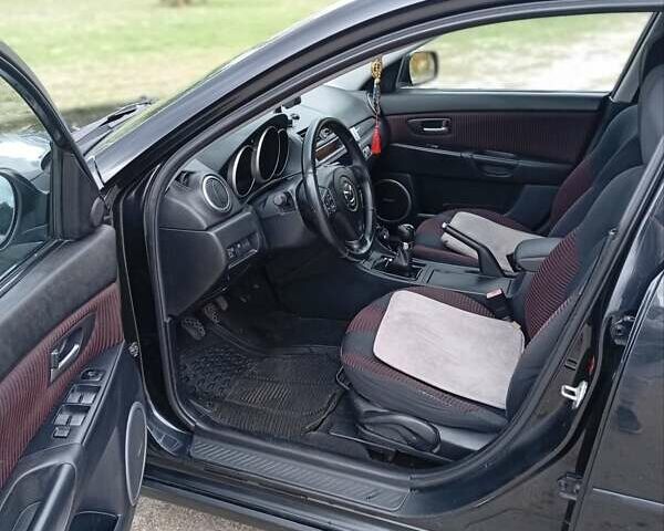 Черный Мазда 3, объемом двигателя 2 л и пробегом 242 тыс. км за 5000 $, фото 3 на Automoto.ua