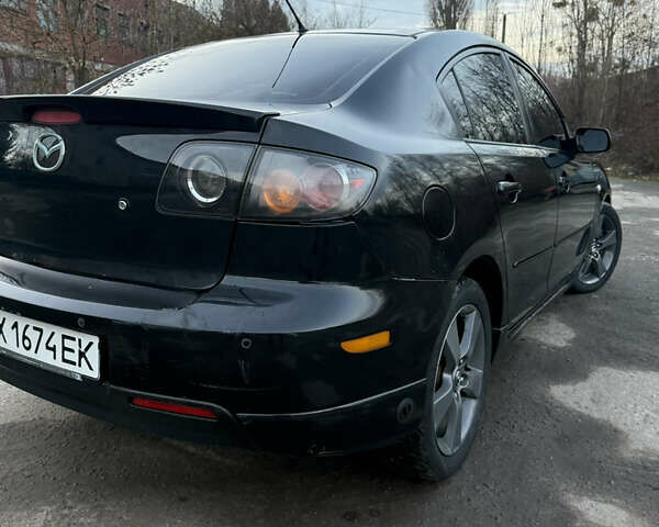 Черный Мазда 3, объемом двигателя 2 л и пробегом 260 тыс. км за 4950 $, фото 4 на Automoto.ua