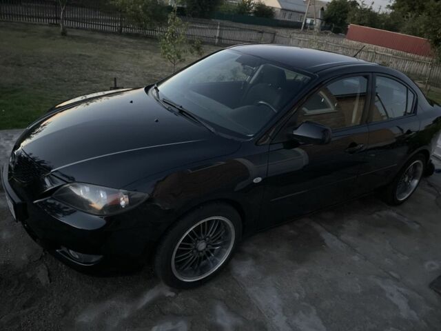 Черный Мазда 3, объемом двигателя 1.6 л и пробегом 173 тыс. км за 6100 $, фото 2 на Automoto.ua