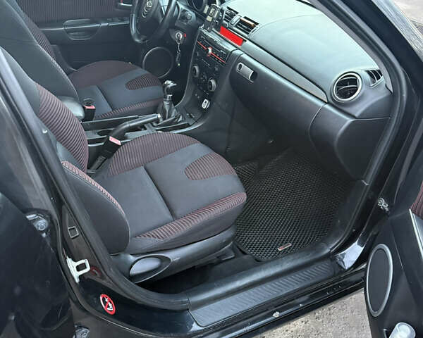 Черный Мазда 3, объемом двигателя 2 л и пробегом 260 тыс. км за 4950 $, фото 13 на Automoto.ua