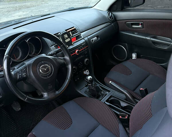 Черный Мазда 3, объемом двигателя 2 л и пробегом 260 тыс. км за 4950 $, фото 10 на Automoto.ua