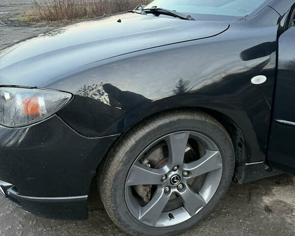 Черный Мазда 3, объемом двигателя 2 л и пробегом 260 тыс. км за 4950 $, фото 7 на Automoto.ua