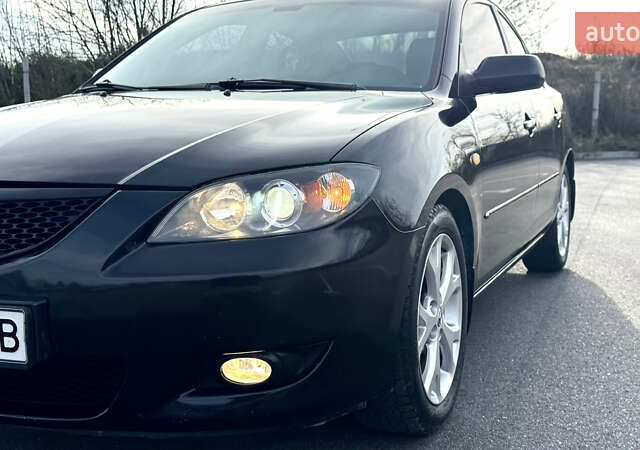 Чорний Мазда 3, об'ємом двигуна 1.6 л та пробігом 237 тис. км за 5850 $, фото 13 на Automoto.ua