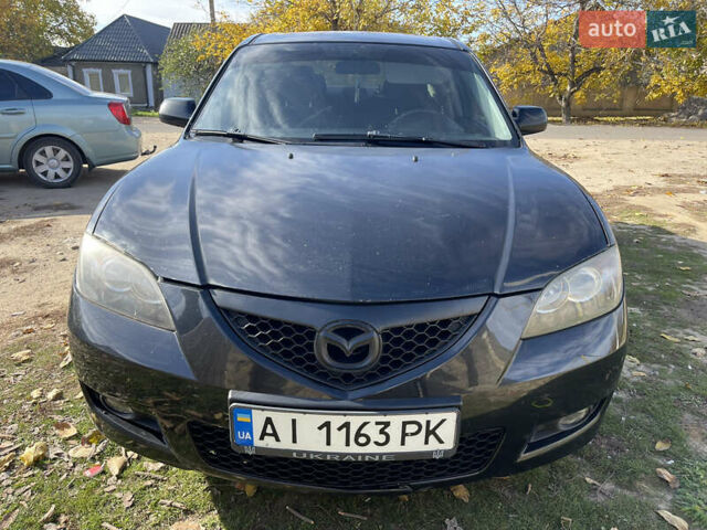 Черный Мазда 3, объемом двигателя 1.6 л и пробегом 300 тыс. км за 4000 $, фото 2 на Automoto.ua