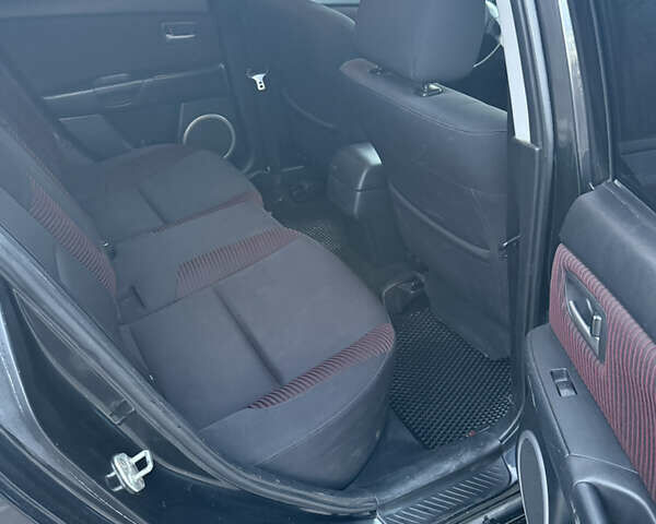 Черный Мазда 3, объемом двигателя 2 л и пробегом 260 тыс. км за 4950 $, фото 12 на Automoto.ua